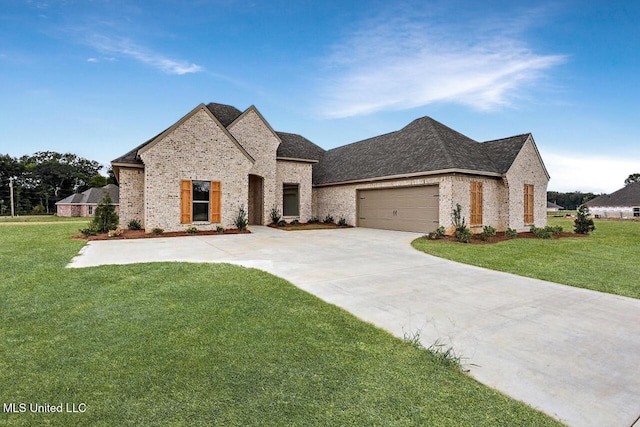 420 Lennon Ln, Brandon, MS 39047 - french country style house featuring concrete driveway, brick siding, a shingled roof, and a front yard