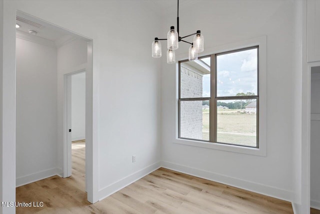 420 Lennon Ln, Brandon, MS 39047 - unfurnished dining area featuring baseboards, a notable chandelier, a healthy amount of sunlight, and light wood finished floors