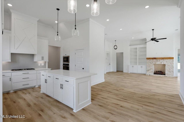 420 Lennon Ln, Brandon, MS 39047 - kitchen with decorative backsplash, ceiling fan, white cabinets, and stainless steel appliances