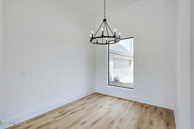 420 Lennon Ln, Brandon, MS 39047 - unfurnished dining area featuring crown molding, light wood-style flooring, baseboards, and a notable chandelier