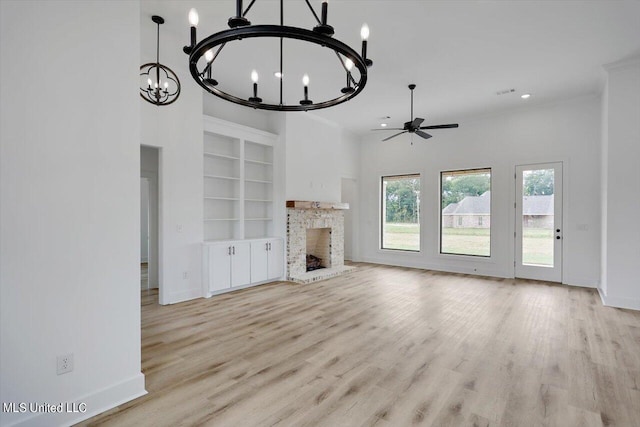 420 Lennon Ln, Brandon, MS 39047 - unfurnished living room featuring light wood-style floors, baseboards, built in features, and a fireplace