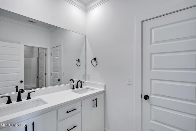 420 Lennon Ln, Brandon, MS 39047 - bathroom with crown molding, double vanity, visible vents, and a sink