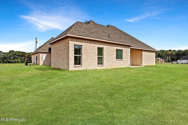 420 Lennon Ln, Brandon, MS 39047 - rear view of house featuring a yard, brick siding, and roof with shingles