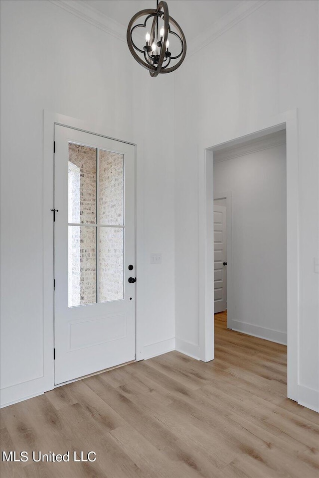 420 Lennon Ln, Brandon, MS 39047 - foyer featuring an inviting chandelier, ornamental molding, light wood-style flooring, and baseboards
