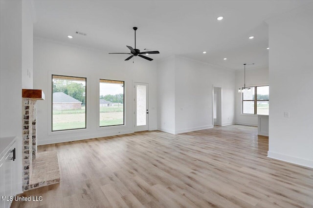 420 Lennon Ln, Brandon, MS 39047 - unfurnished living room featuring recessed lighting, light wood-style flooring, ceiling fan with notable chandelier, and baseboards