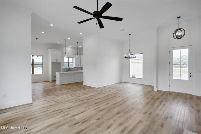 420 Lennon Ln, Brandon, MS 39047 - unfurnished living room with recessed lighting, ornamental molding, light wood finished floors, and baseboards