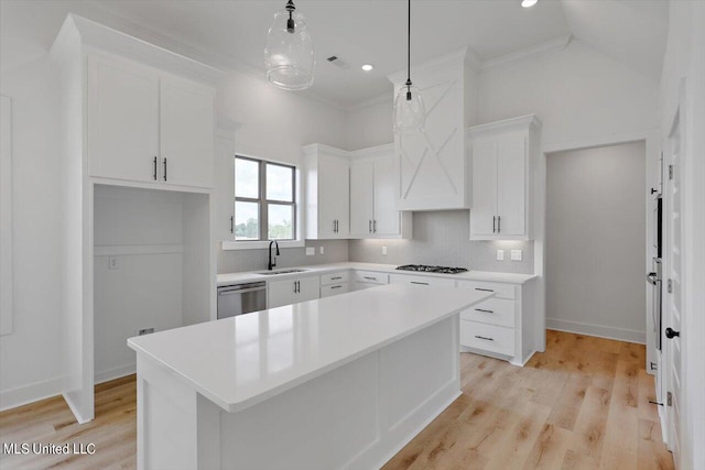420 Lennon Ln, Brandon, MS 39047 - kitchen featuring stainless steel dishwasher, gas cooktop, a center island, white cabinets, and a sink