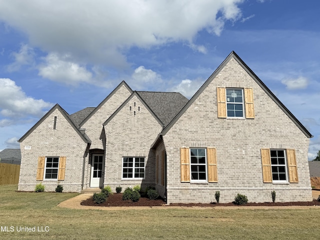3164 Winterwood Dr, Hernando, MS 38632 - view of front of home featuring brick siding, fence, and a front yard