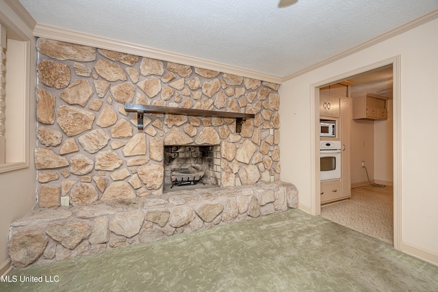 unfurnished living room with carpet flooring, a stone fireplace, crown molding, and a textured ceiling