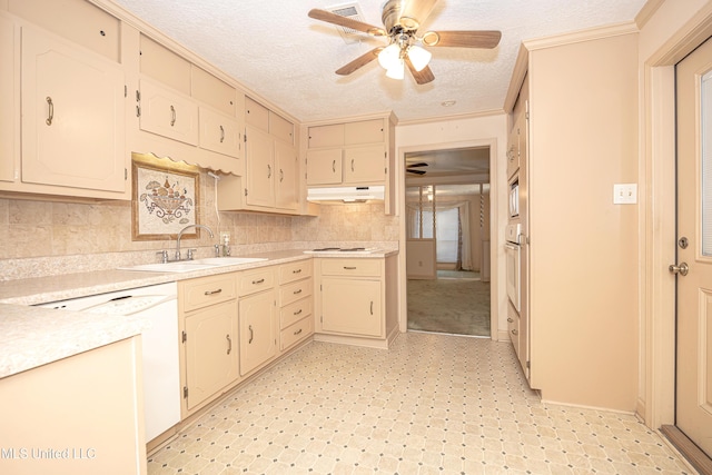 kitchen with a textured ceiling, white appliances, ceiling fan, sink, and cream cabinetry