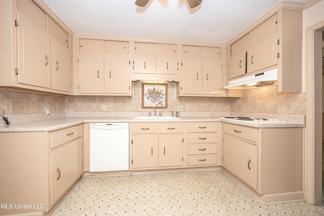 kitchen featuring a textured ceiling, ceiling fan, white appliances, and sink