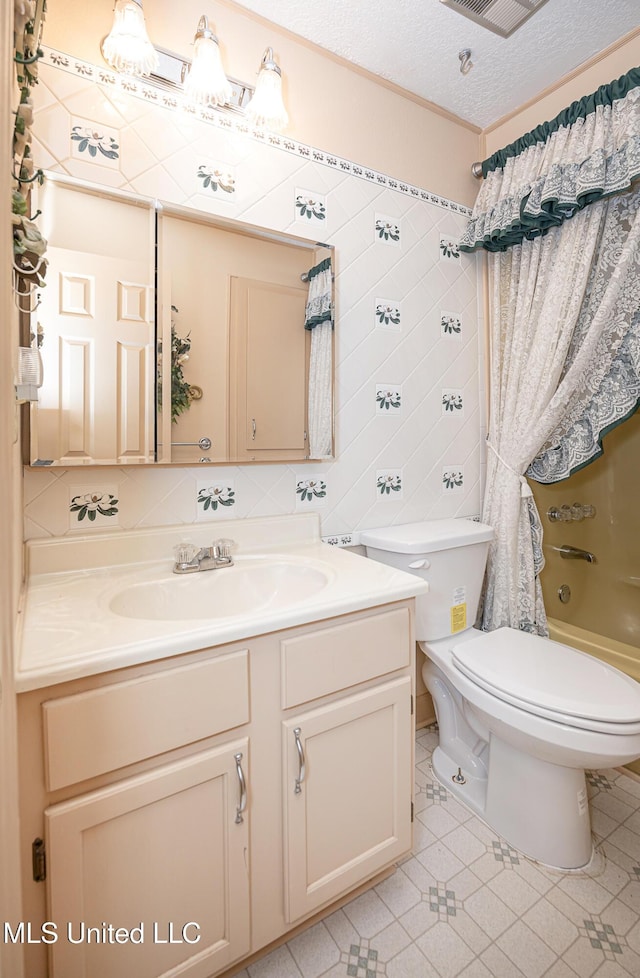 full bathroom with tasteful backsplash, a textured ceiling, vanity, tile patterned flooring, and toilet