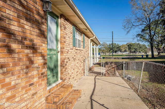 view of side of home featuring a patio