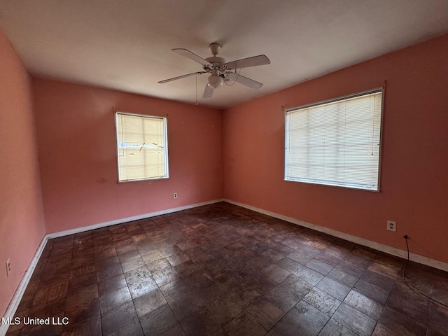 230 Hillside Dr, Vicksburg, MS 39180 - spare room featuring baseboards and ceiling fan