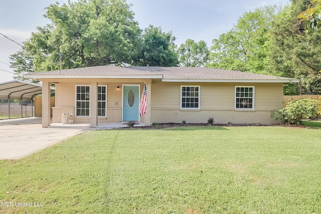 single story home with a detached carport, driveway, fence, brick siding, and a front yard