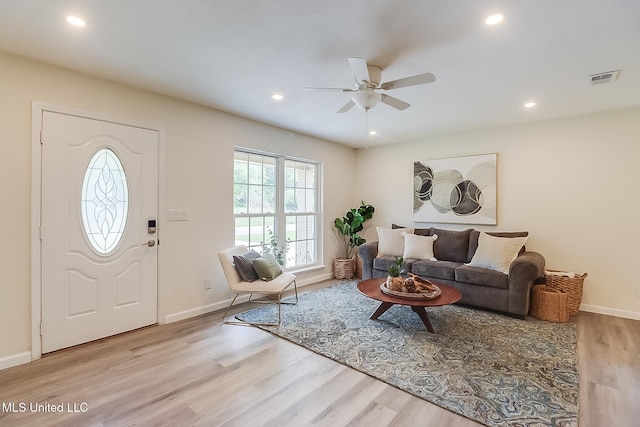living area with recessed lighting, wood finished floors, and ceiling fan