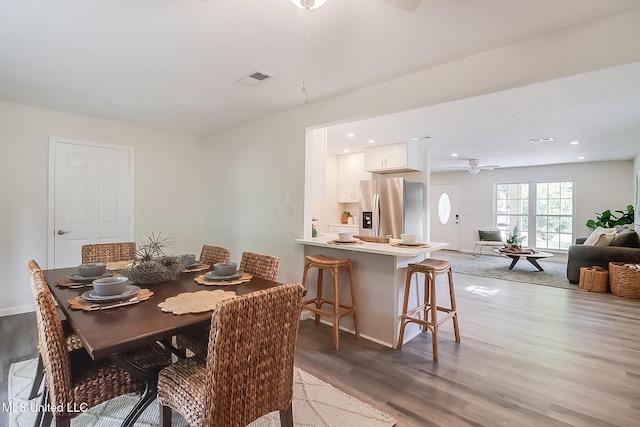 dining room with recessed lighting, light wood finished floors, visible vents, and a ceiling fan