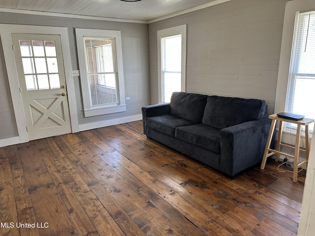 living area featuring dark wood finished floors and baseboards