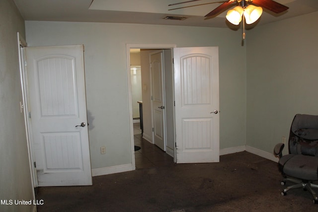 unfurnished office featuring ceiling fan