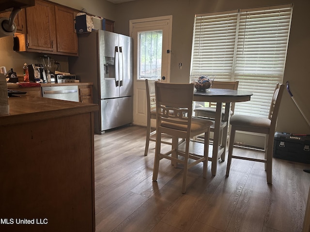 dining area with light wood-style floors