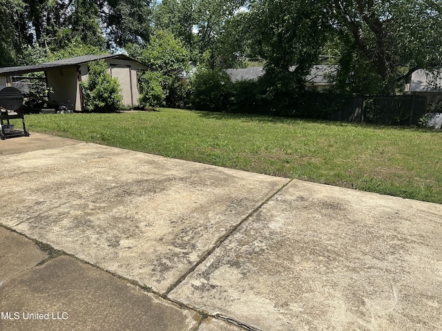 view of yard with a shed and an outbuilding