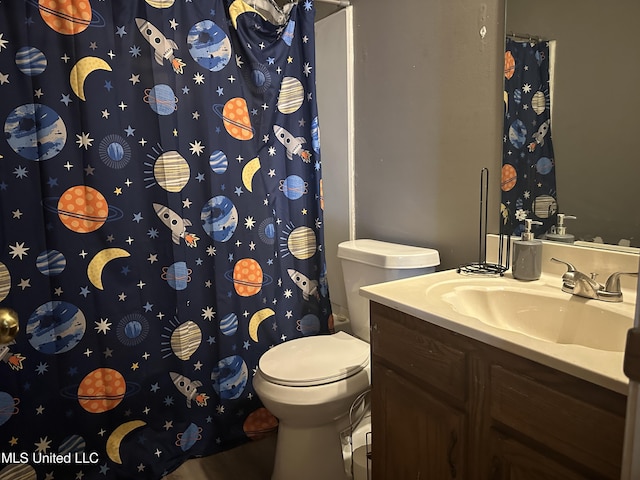 full bath featuring toilet, a shower with shower curtain, and vanity