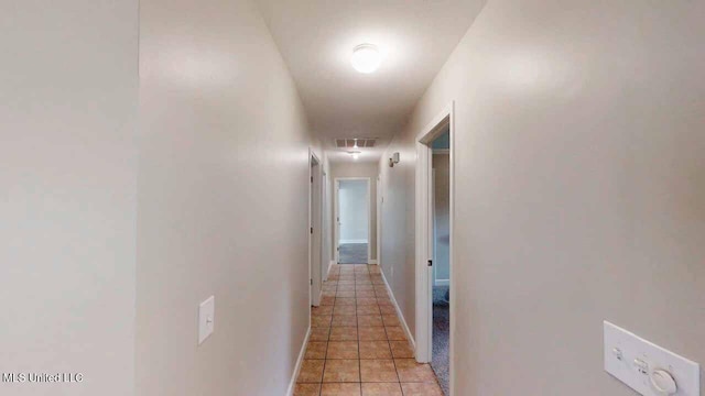 594 Acorn Ln, Brandon, MS 39047 - corridor with light tile patterned flooring and baseboards