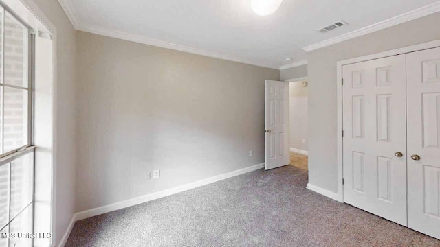 594 Acorn Ln, Brandon, MS 39047 - unfurnished bedroom with carpet floors, crown molding, and a closet