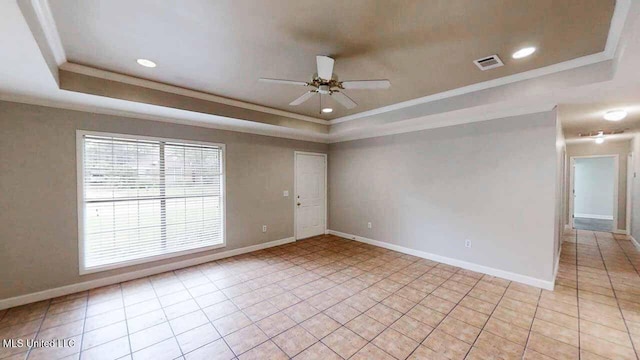 594 Acorn Ln, Brandon, MS 39047 - unfurnished room with a tray ceiling, ceiling fan, crown molding, light tile patterned floors, and recessed lighting