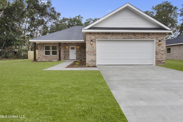 view of front of home featuring a garage and a front lawn