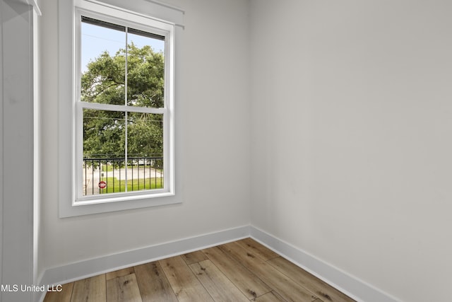 124 Court St, Bay Saint Louis, MS 39520 - empty room featuring wood finished floors and baseboards