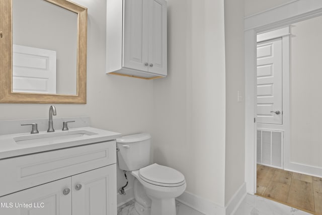 124 Court St, Bay Saint Louis, MS 39520 - half bathroom featuring vanity and marble look tile flooring