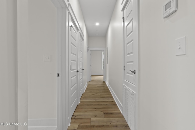 124 Court St, Bay Saint Louis, MS 39520 - corridor featuring recessed lighting and light wood-style floors