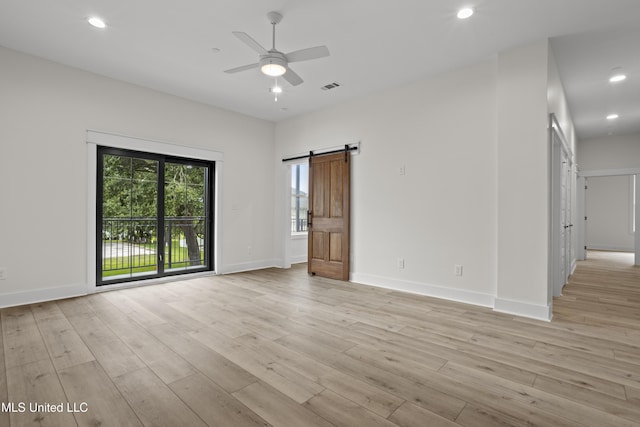 124 Court St, Bay Saint Louis, MS 39520 - empty room featuring a ceiling fan, light wood finished floors, recessed lighting, and a barn door