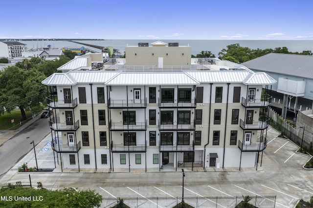 124 Court St, Bay Saint Louis, MS 39520 - view of apartment building / complex featuring a water view
