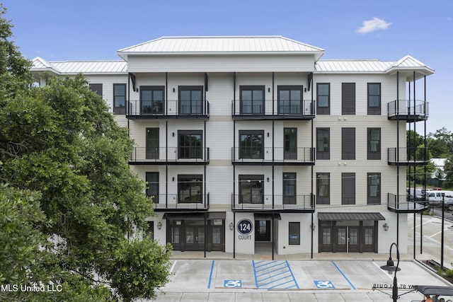 124 Court St, Bay Saint Louis, MS 39520 - view of building exterior with uncovered parking