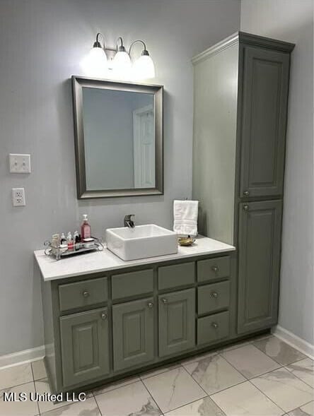361 Cherry Bark Ln, Courtland, MS 38620 - bathroom featuring baseboards, vanity, and marble finish flooring