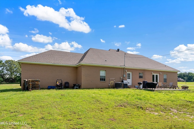 361 Cherry Bark Ln, Courtland, MS 38620 - rear view of property featuring a patio, a yard, brick siding, and a shingled roof