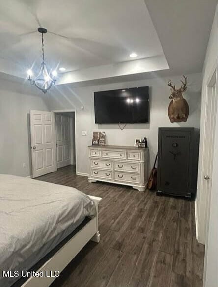 361 Cherry Bark Ln, Courtland, MS 38620 - bedroom with dark wood finished floors, a chandelier, recessed lighting, and baseboards