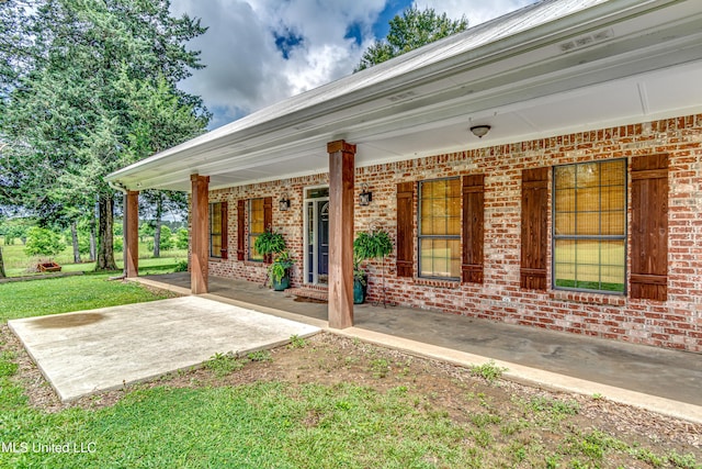 4661 Wildwood Rd, Benton, MS 39039 - covered porch featuring a yard