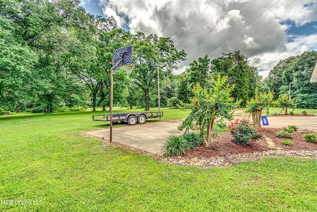4661 Wildwood Rd, Benton, MS 39039 - view of community featuring a yard and view of wooded area