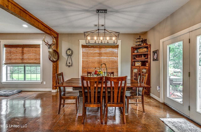 4661 Wildwood Rd, Benton, MS 39039 - tiled dining area featuring baseboards and a chandelier