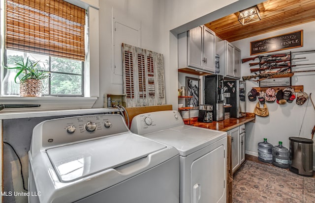 4661 Wildwood Rd, Benton, MS 39039 - washroom with cabinet space, washer and dryer, wooden ceiling, and baseboards