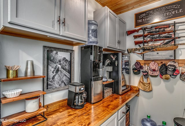 4661 Wildwood Rd, Benton, MS 39039 - kitchen featuring wood counters, wooden ceiling, and baseboards