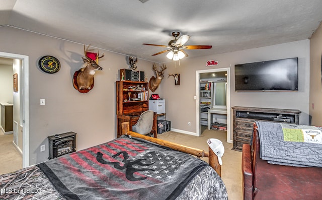 4661 Wildwood Rd, Benton, MS 39039 - carpeted bedroom featuring a ceiling fan and baseboards