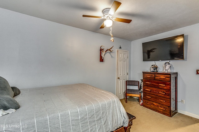 4661 Wildwood Rd, Benton, MS 39039 - bedroom featuring light carpet, a ceiling fan, and baseboards