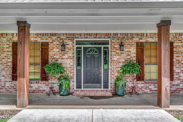 4661 Wildwood Rd, Benton, MS 39039 - view of exterior entry featuring brick siding and covered porch