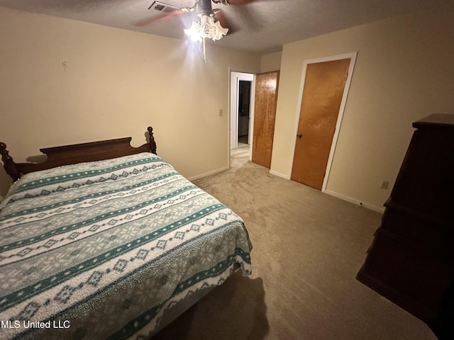 bedroom featuring ceiling fan and light carpet