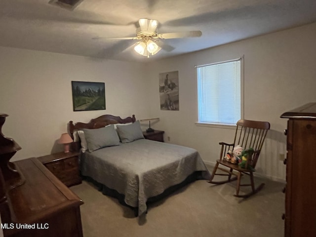 bedroom with light carpet and ceiling fan