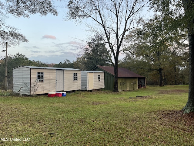 view of outbuilding with a yard